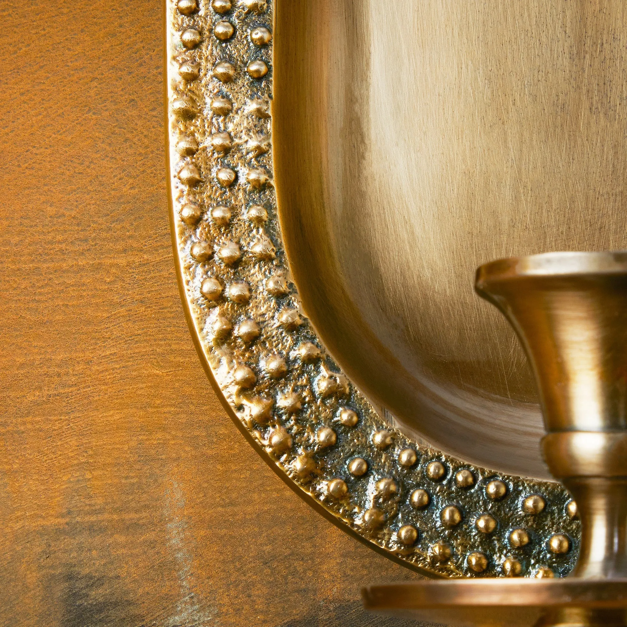 Beacon wall mounted candle holder in antiqued brass