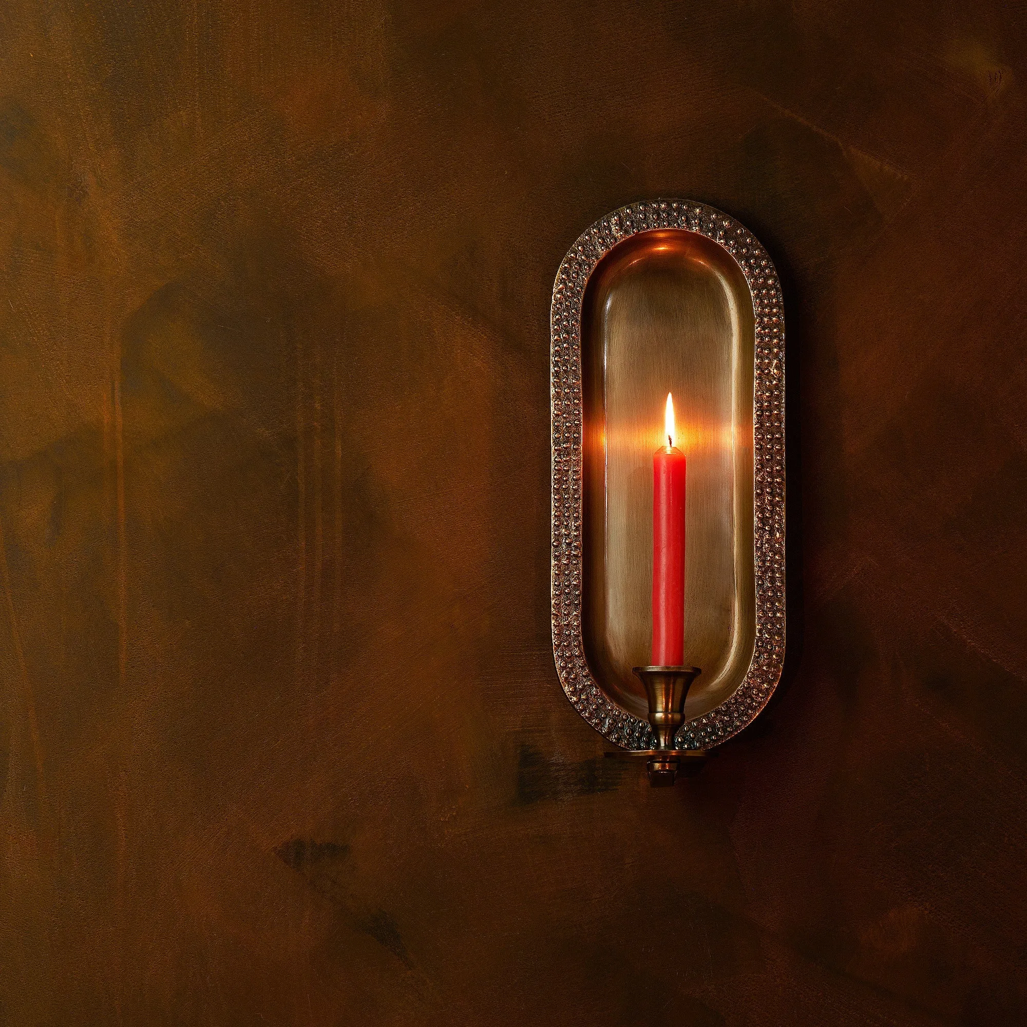Beacon wall mounted candle holder in antiqued brass