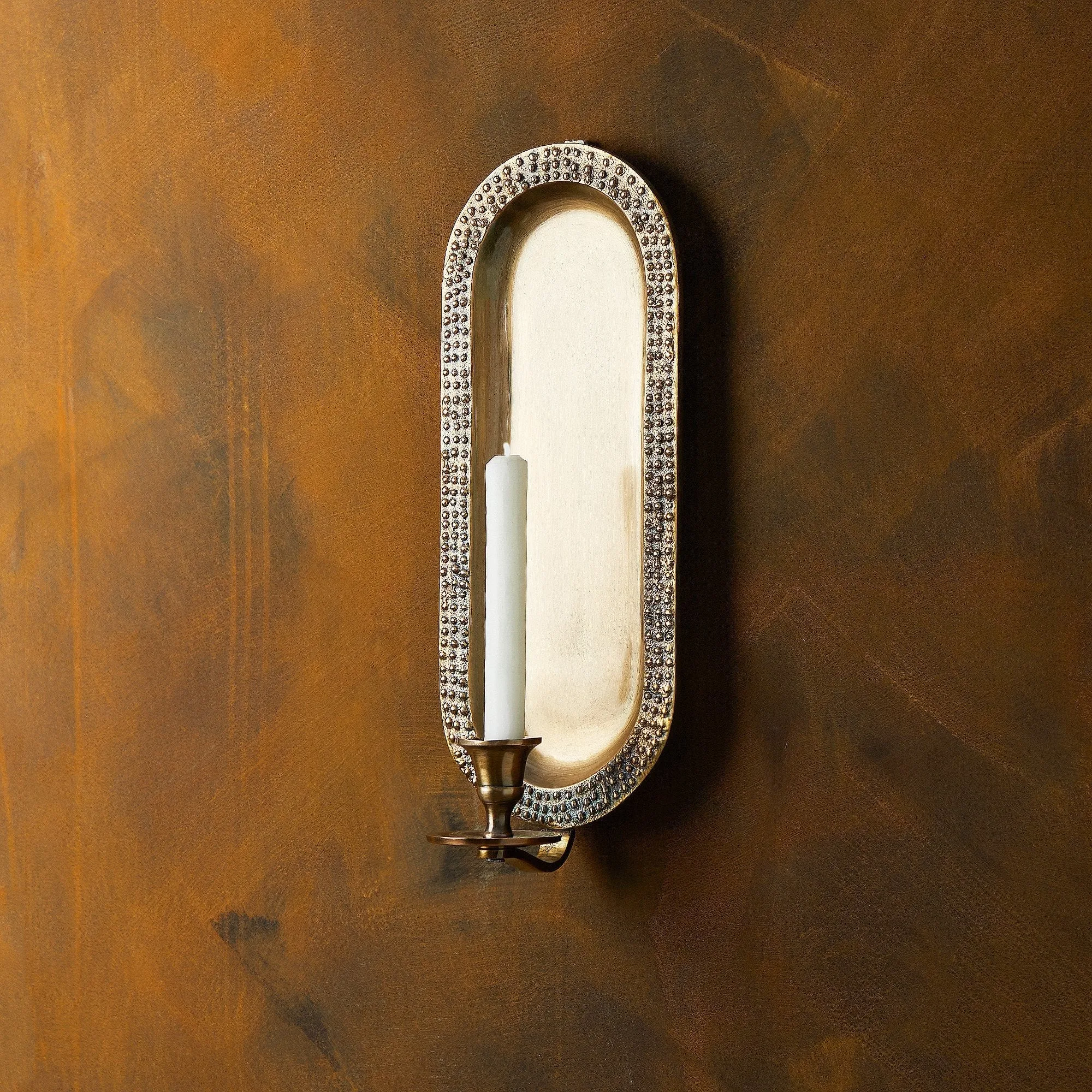 Beacon wall mounted candle holder in antiqued brass