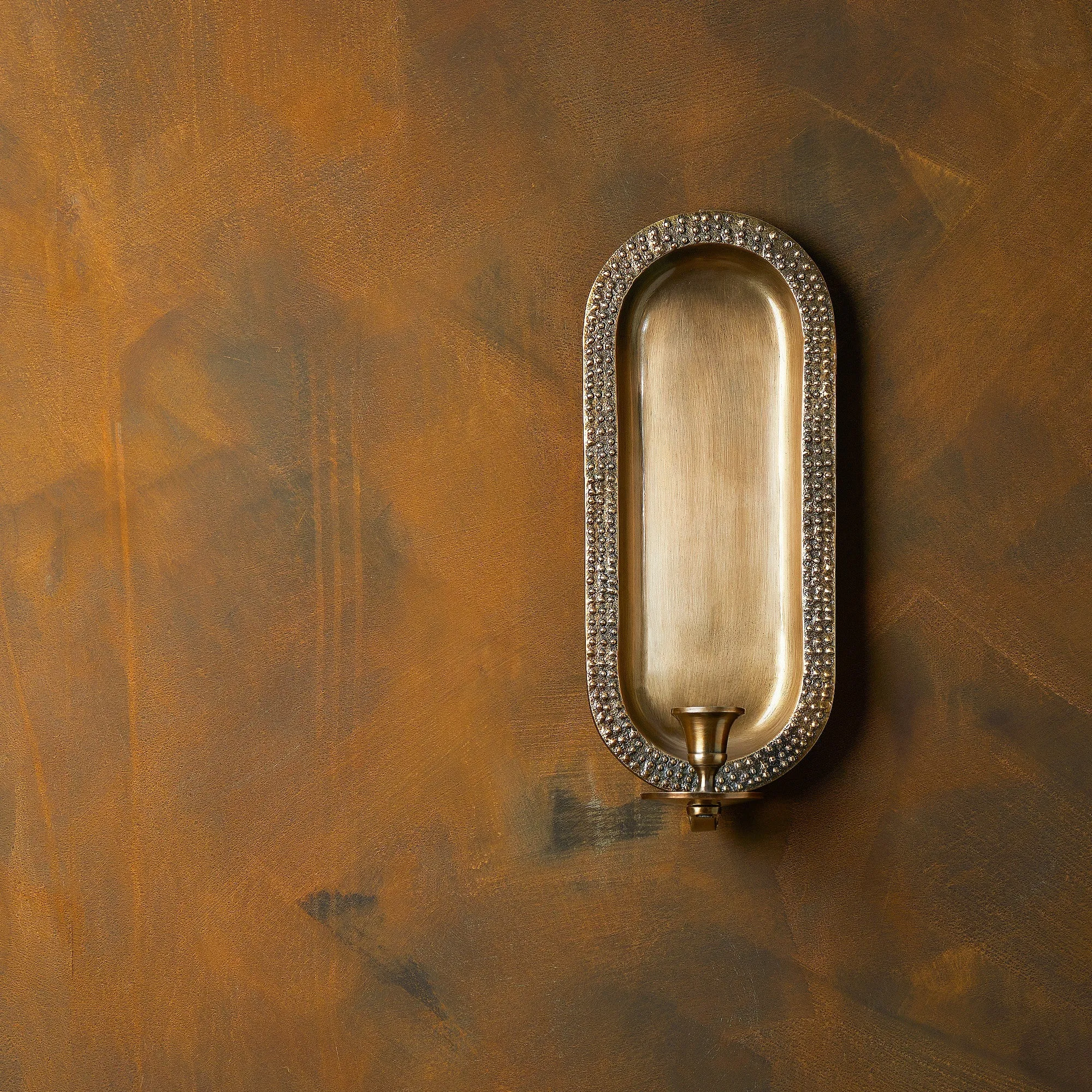 Beacon wall mounted candle holder in antiqued brass