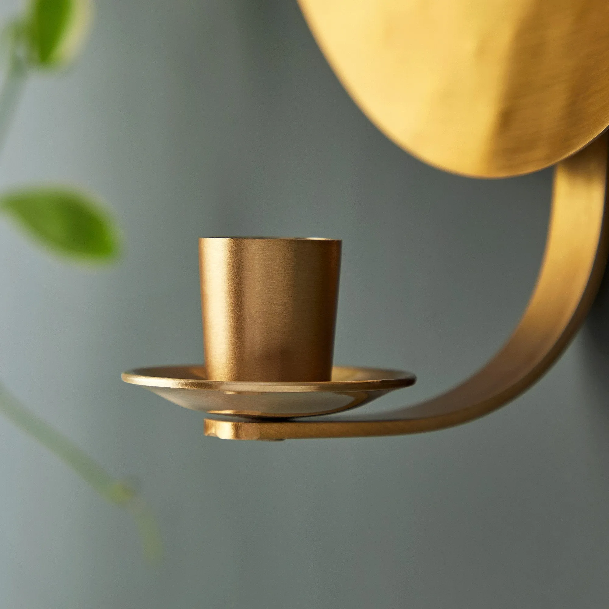 Celeste wall mounted candle holder in antique brass