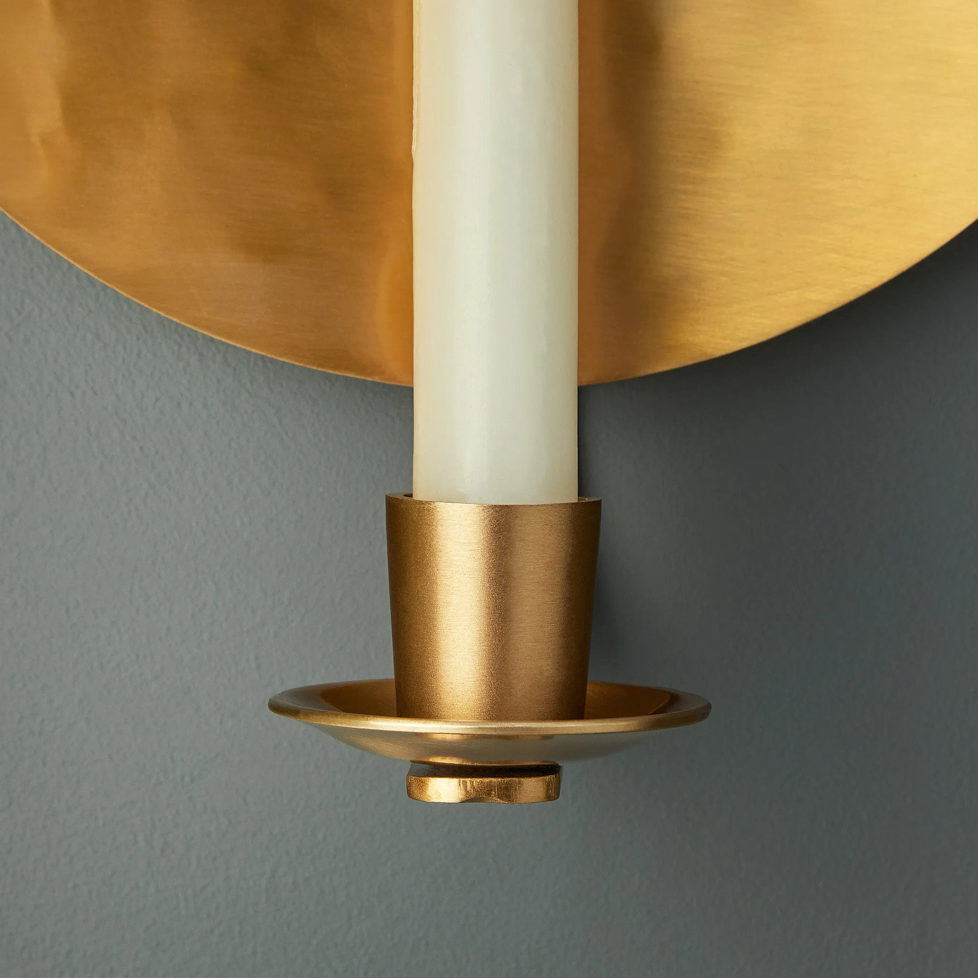 Celeste wall mounted candle holder in antique brass